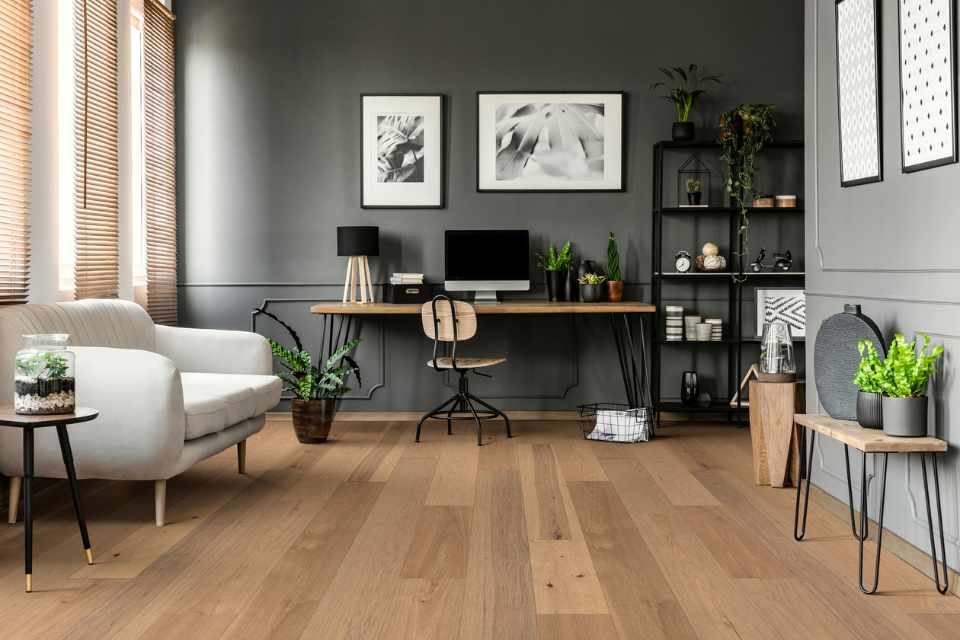 hickory hardwood in modern grey living room with home office set up